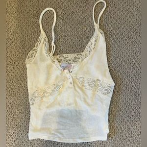 Brand new tank top with lace. Very stylish. Too small for me